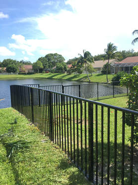a backyard with a nice new aluminum fencing